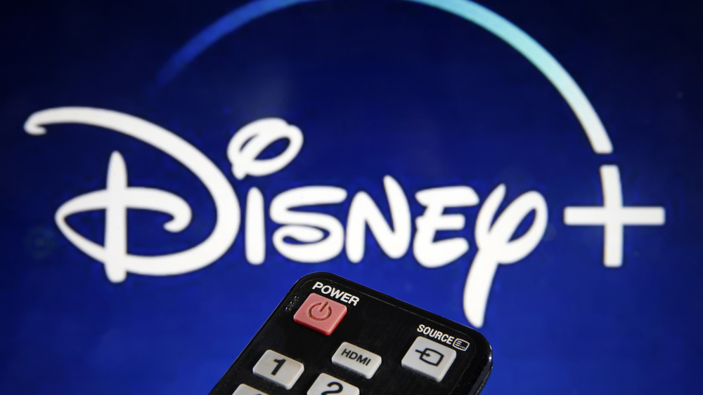 The Disney+ logo with a remote control