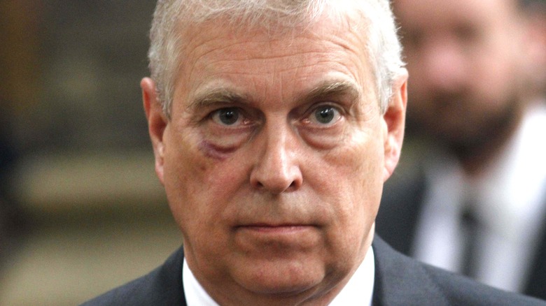 Prince Andrew looking solemn