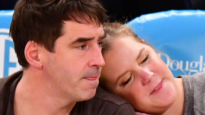 Amy Schumer and husband Chris Fischer snuggling