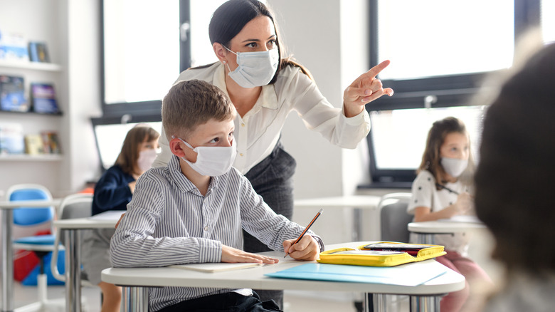 teacher and students wearing face masks in class