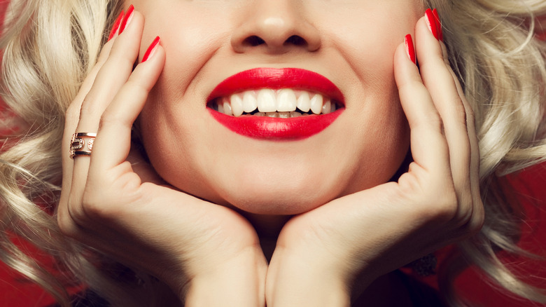 Woman smiling wearing bright lipstick