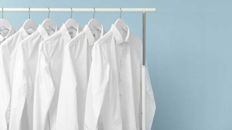 White shirts on clothing rack