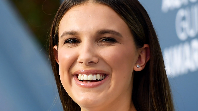 Millie Bobby Brown laughs on the red carpet