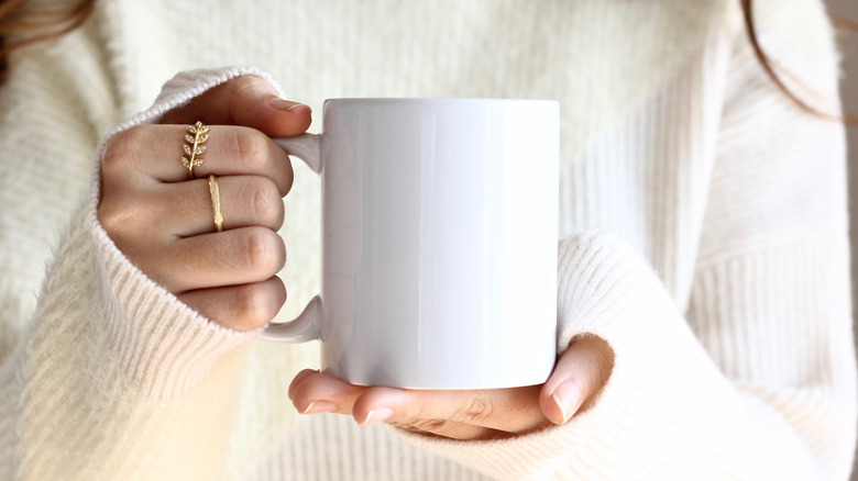 Woman holding a mug of coffee