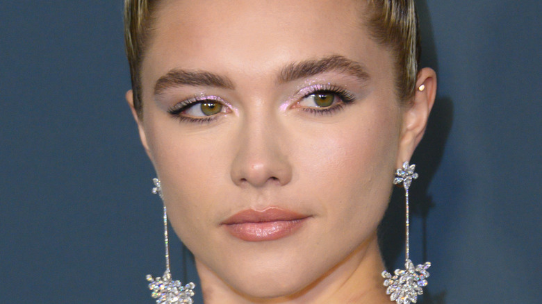 Florence Pugh poses on the red carpet