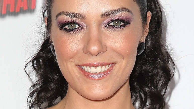 Adrianne Curry smiling for cameras