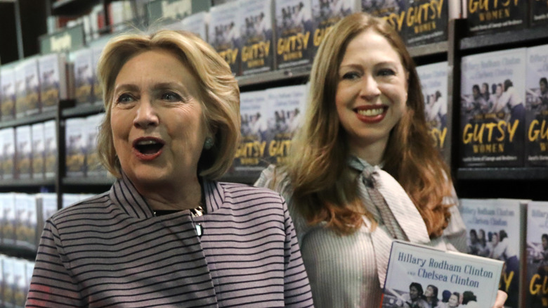 Hillary and Chelsea Clinton hold Gutsy Woman