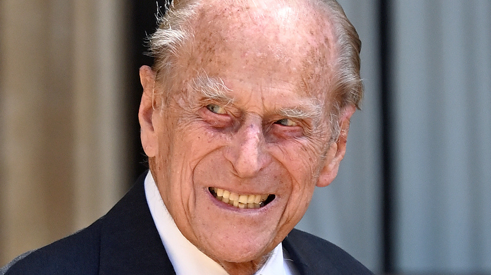 Prince Philip smiling outside, close-up