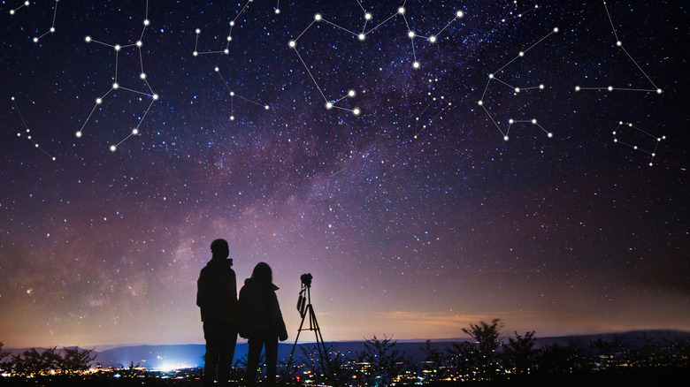 Couple looking up at constellations