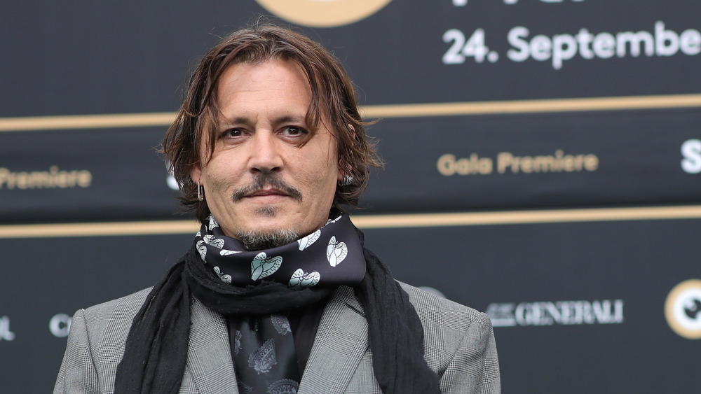 Johnny Depp wearing a heart scarf