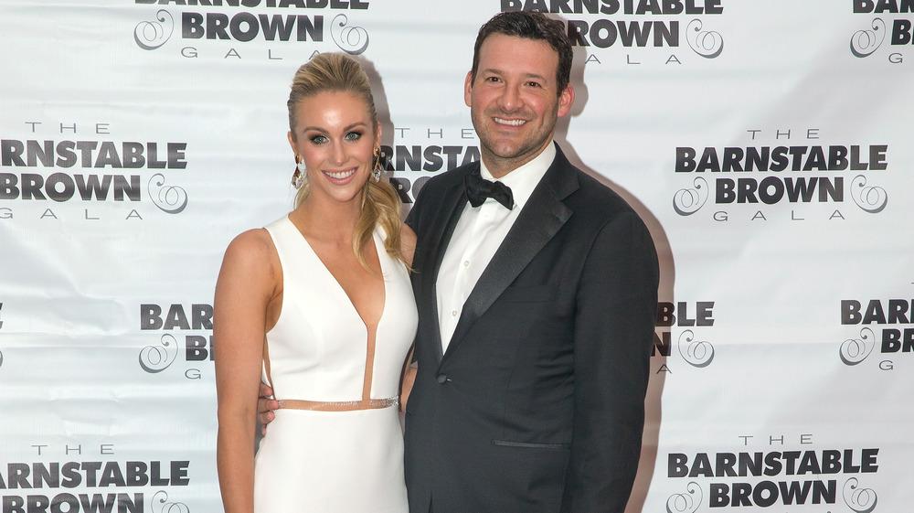 Tony Romo smiles with his wife Candice Crawford