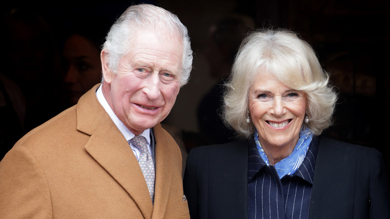 King Charles and Queen Camilla smiling together 