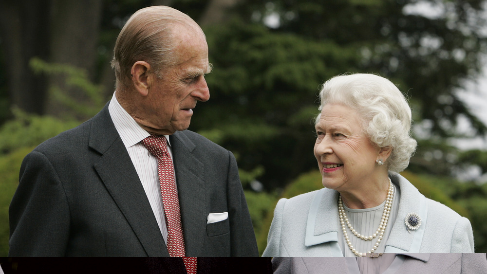 Prince Philip and Queen Elizabeth looking at each other