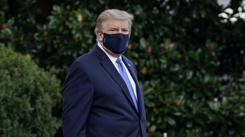 Donald Trump wearing a big mask