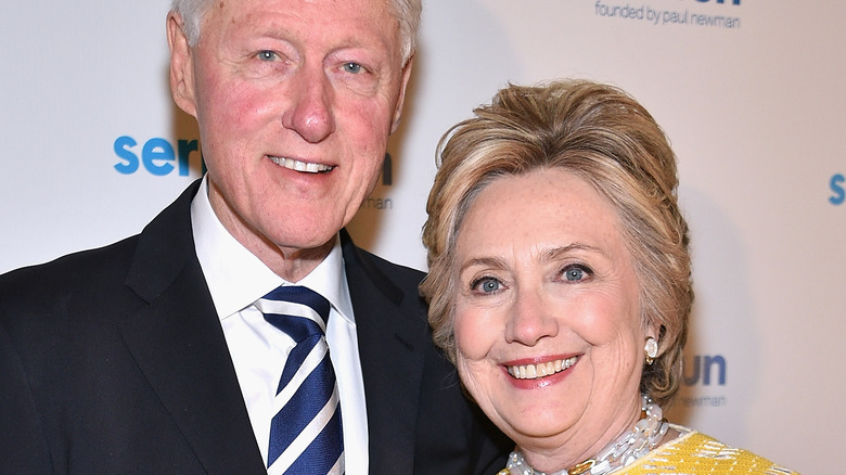 Hillary Clinton and Bill Clinton smile