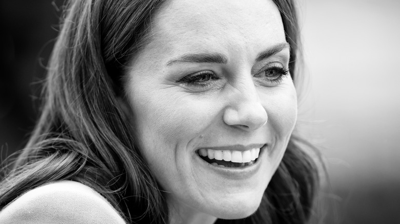 Kate Middleton smiles in black and white photo