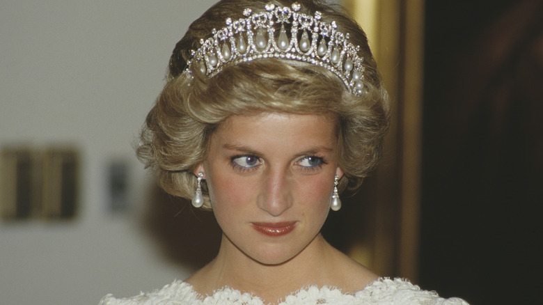 Princess Diana looks off to one side