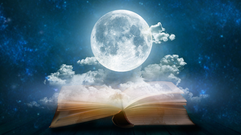 Full moon above open book