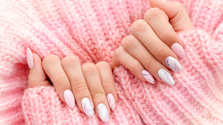 manicure with marble polish and sweater