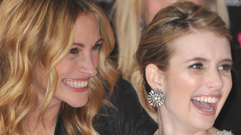 Emma Roberts and Julia Roberts smiling at a movie premiere