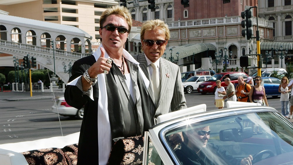 Siegfried and Roy in a convertible