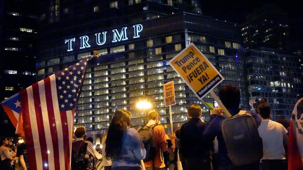 People rallying outside Trump hotel
