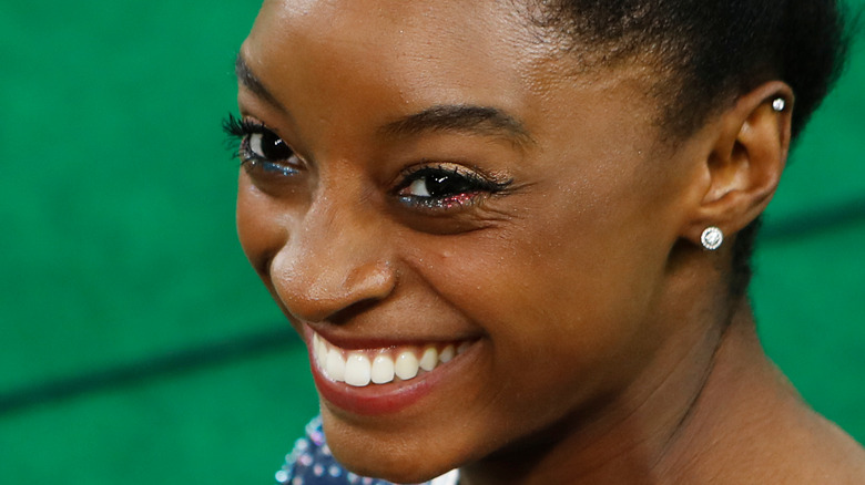 Simone Biles smiling at competition
