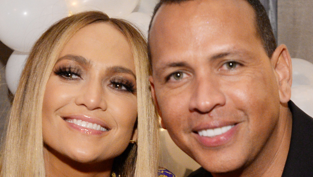 Jennifer Lopez and Alex Rodriguez smiling at event