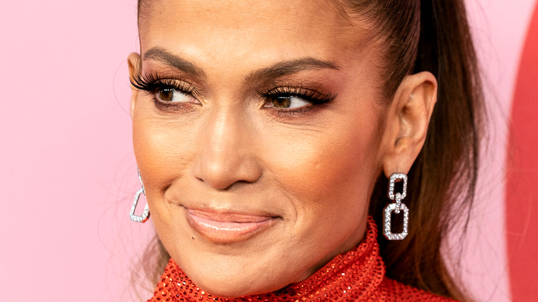 Jennifer Lopez smiles on the red carpet.