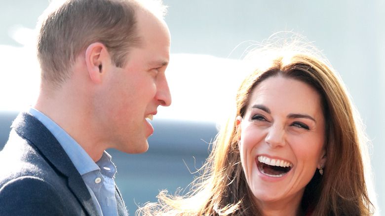 Kate Middleton laughs at something Prince William says