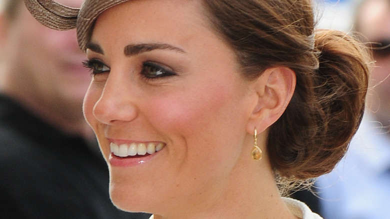 Kate Middleton smiling in fascinator