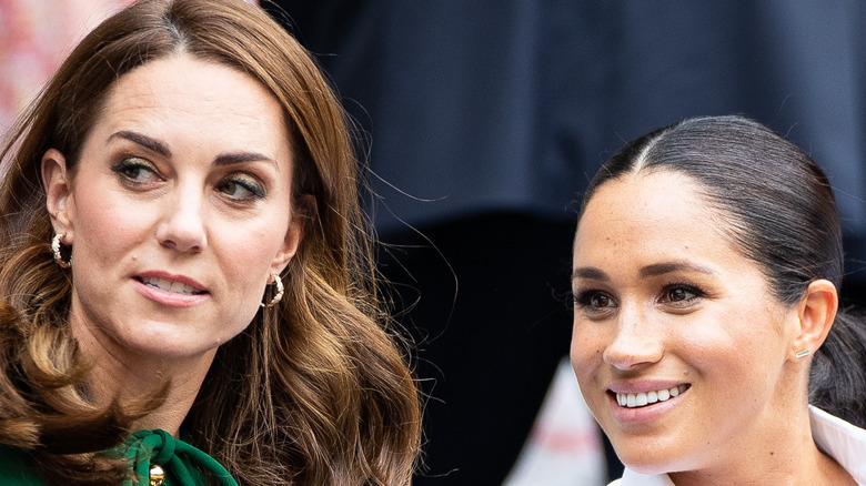 Kate Middleton and Meghan Markle at tennis event