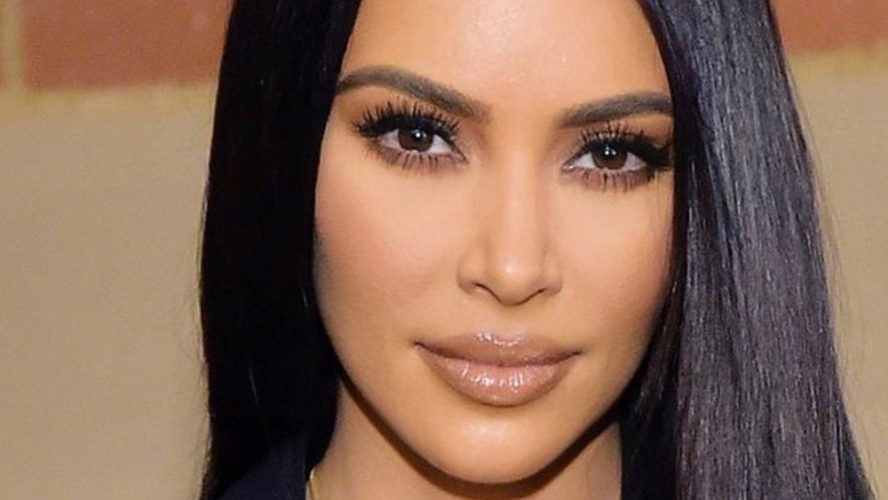Kim Kardashian slight grin hair down