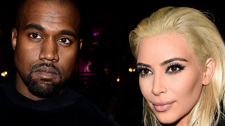 Kanye West and Kim Kardashian posing
