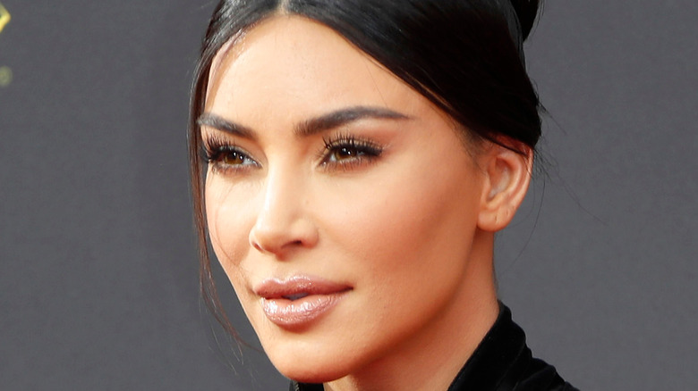 Kim Kardashian in profile with her hair up