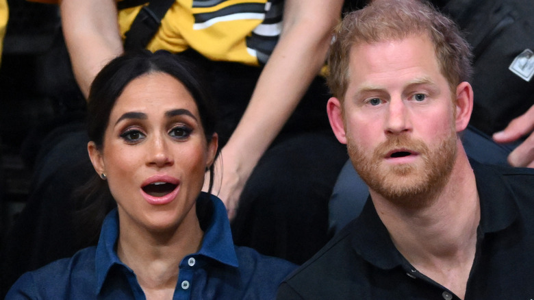 Prince Harry and Meghan Markle looking surprised