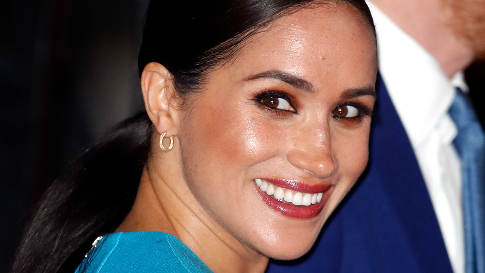 Meghan Markle smiles with Prince Harry