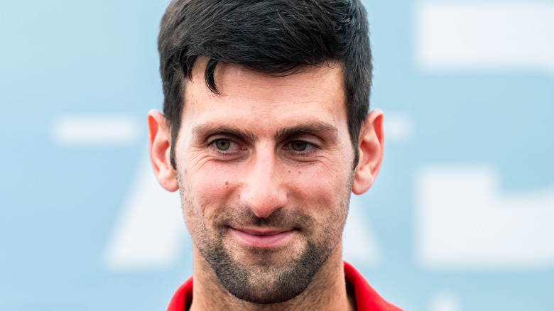 Tennis player Novak Djokovic smiling