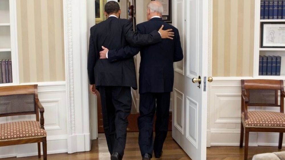 Biden and Obama exiting Oval Office