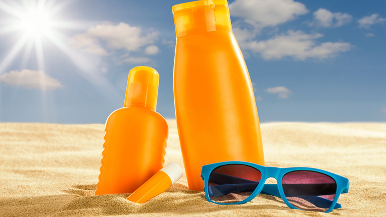 sunscreen products in the sand