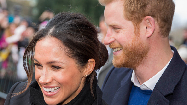 Prince Harry and Meghan Markle with crowds