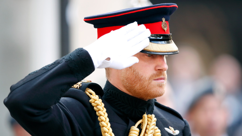 Prince Harry saluting in uniform