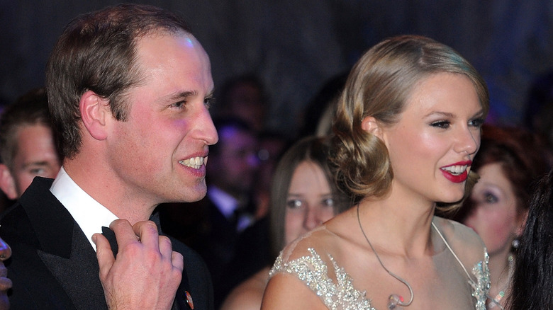 Prince William standing with Taylor Swift