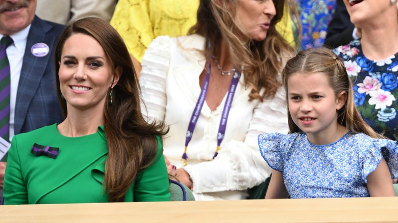 Kate Middleton sitting with Princess Charlotte