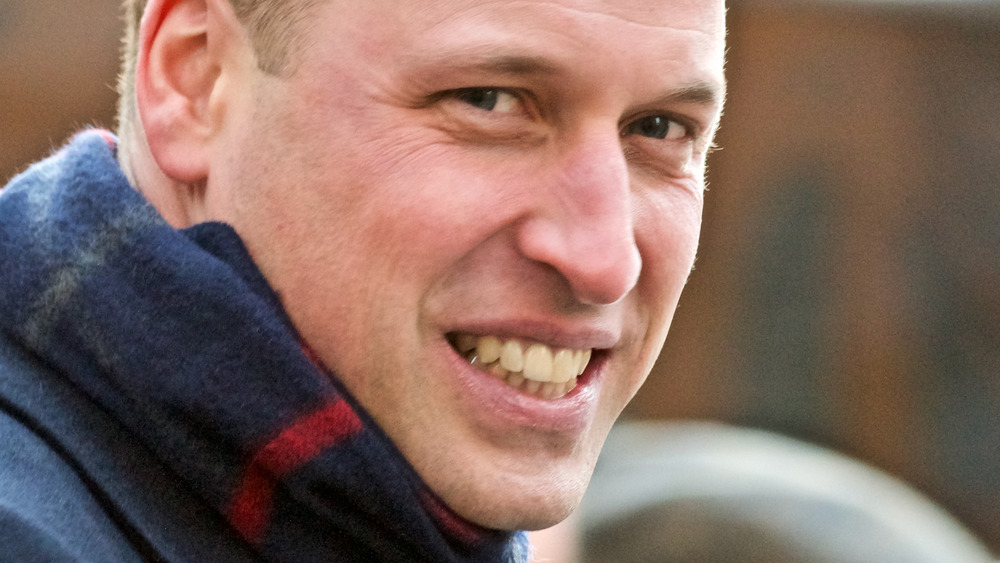 Prince William wearing scarf smiling