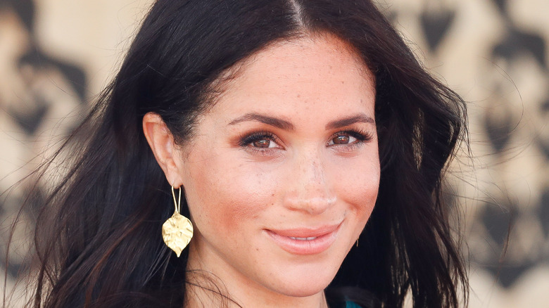 Meghan Markle smiles at an event.