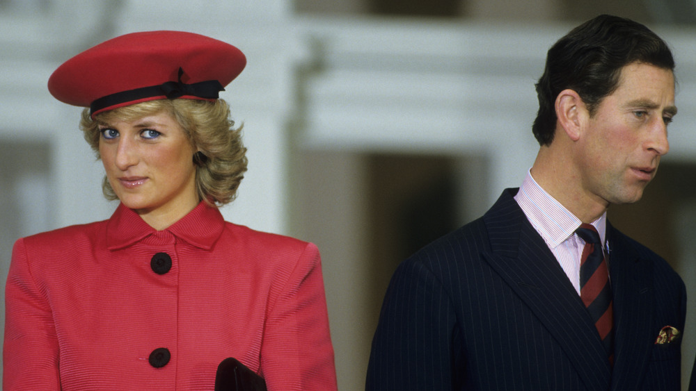 Prince Charles and Princess Diana looking in different directions