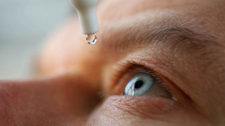 Closeup of drops going in eyes