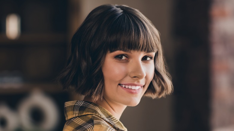 woman with short hair with bangs