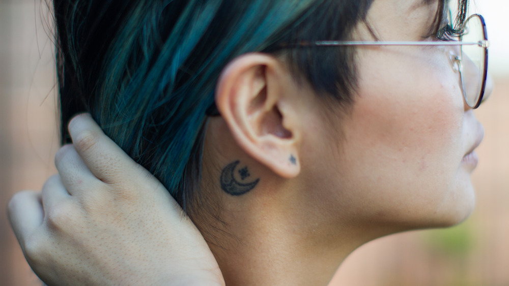 Ai Miyata's tattoos behind ear